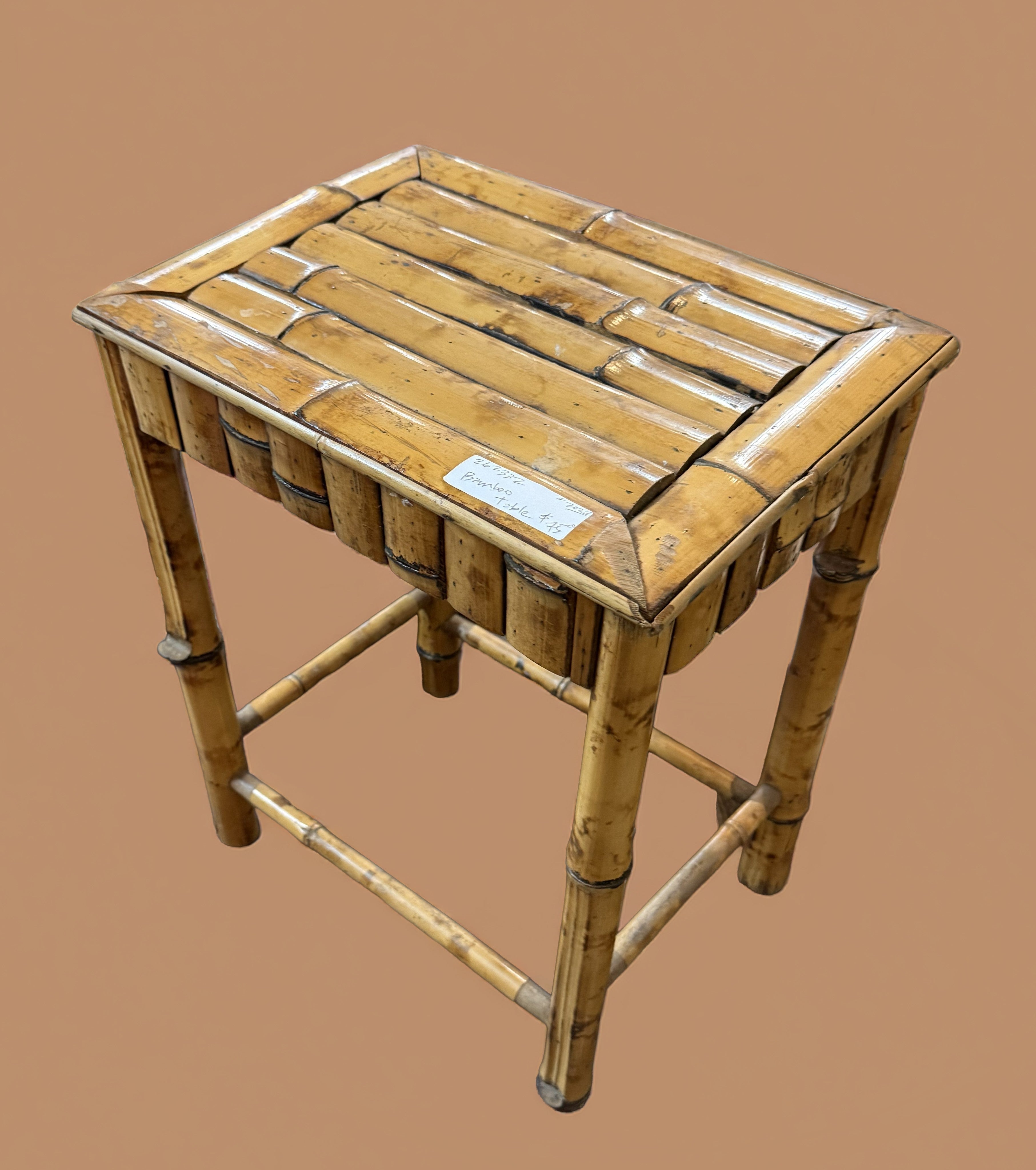 Vintage tortoise-shell bamboo table with mottled caramel-and-espresso finish, styled as a home accent piece