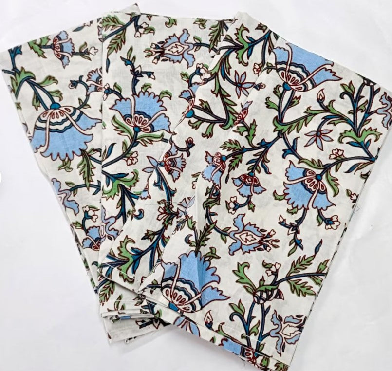 Hand block-printed floral cotton napkins in pink tones, showcasing traditional Indian textile craftsmanship